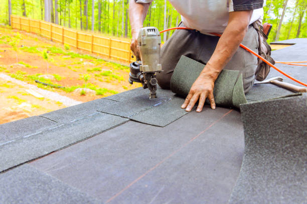 istock Construction worker by roofer installing new bitumen shingles on roof used air pneumatic nail a gun 2161405335