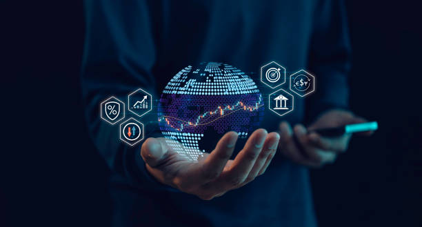 istock A person holds a digital globe in while interacting with a smartphone in the other. The globe and financial technological icons, symbolizing global finance, data analysis, and modern technology. 2161405930