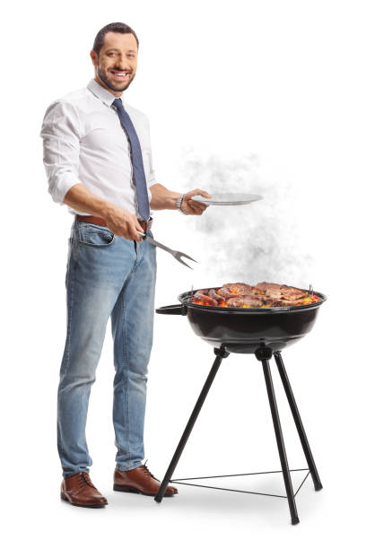 istock Businessman making a barbecue and holding a plate 2161406947
