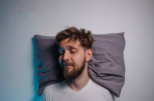 istock Mans sound asleep on a pillow, resting , goodnight sleep 2161407550