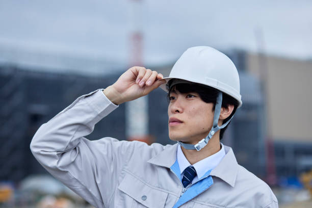 istock A businessman at a construction site wearing a helmet 2161410345
