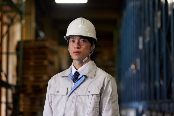 istock A man wearing work clothes inspecting a factory 2161410535