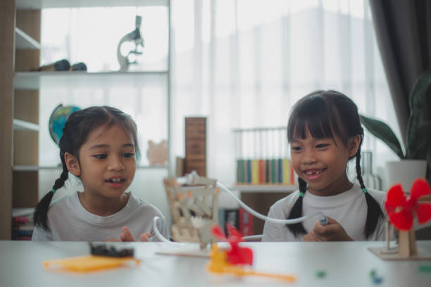 istock STEM education concept. Asian students learn at home with STEM toys, mathematics engineering science technology computer code in robotics for kids' concepts. 2161410820