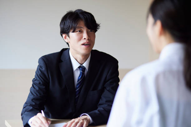 istock A businessman in a suit giving an explanation 2161410993
