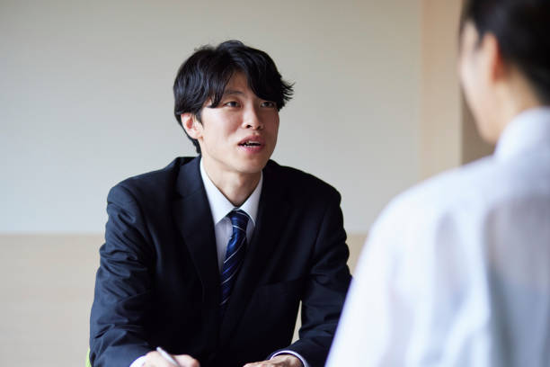 istock A businessman in a suit giving an explanation 2161410996