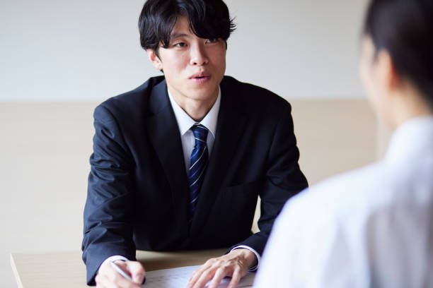 istock A businessman in a suit giving an explanation 2161410997