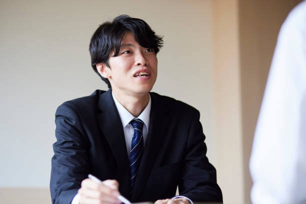 istock A businessman in a suit giving an explanation 2161411000