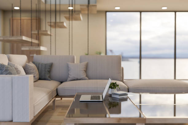 istock A laptop computer on a modern coffee table in a contemporary luxurious living room. 2161411098