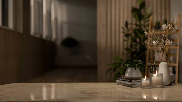 istock A copy space for displaying products on a neutral marble tabletop in a dark room at night. 2161411143