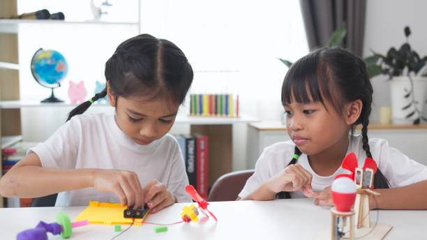 istock STEM education concept. Asian students learn at home with STEM toys, mathematics engineering science technology computer code in robotics for kids' concepts. 2161411864