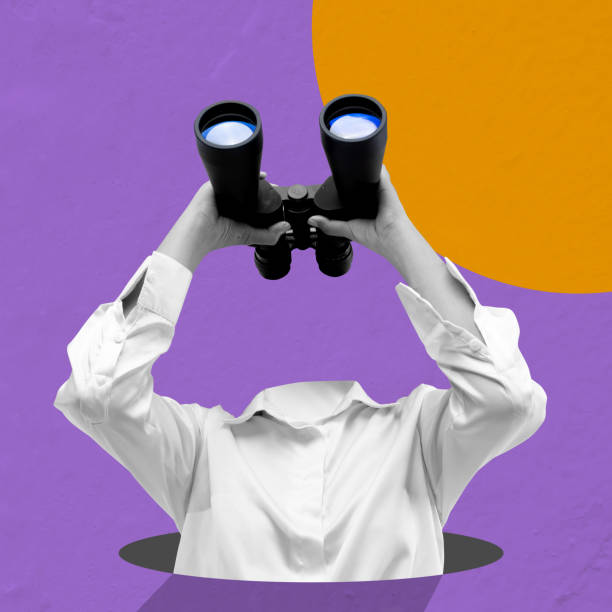 istock Businesswoman looking through the binoculars 2161414393