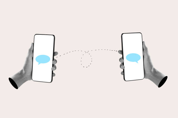 istock Human hand holding mobile phones with a speech bubble 2161414604