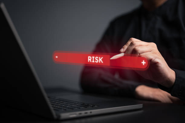istock High risk evaluation in business, decision making and risk analysis. Risky business, crisis management control and emergency strategy plan. Pen drag on the red gauge of virtual measuring level bar. 2161414831