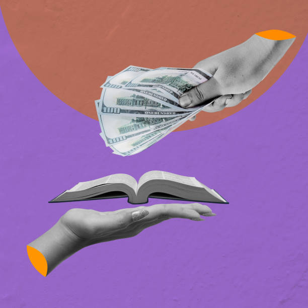 istock Hand giving money to another hand holding an open book 2161416463