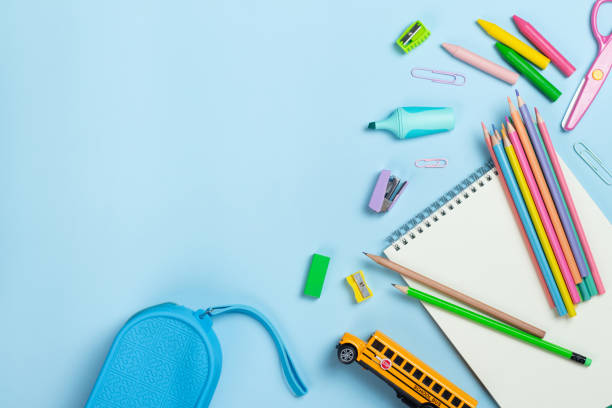 istock Colorful school supplies, scissors, notepad, blue pencil case on light blue background. Back to school, education concept. 2161417446