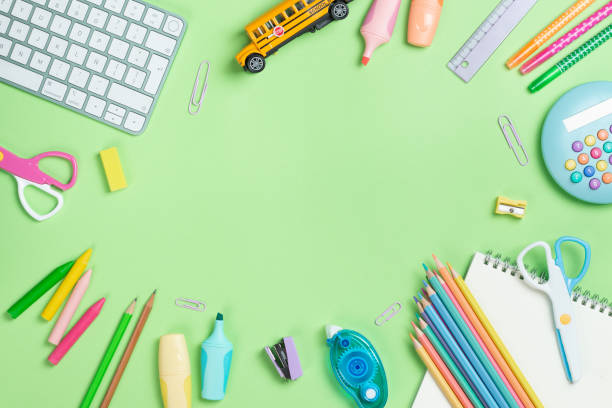 istock Back to school concept. Flat lay composition with Keyboard and school supplies on green background with copy space. 2161417471