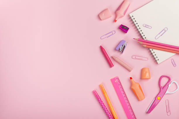 istock Back to school concept. pencils, sharpener, scissors, pens on pink background with copy space. Flat lay, top view. 2161417490