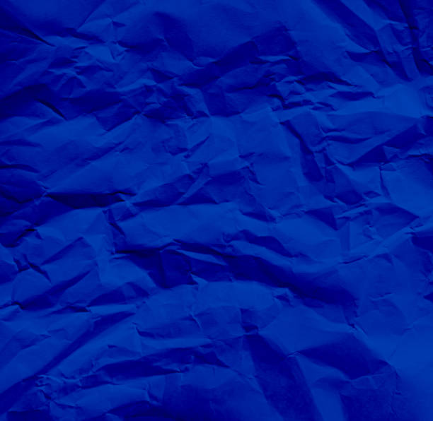 istock Background paper blue crumpled textrue wrinkle sheet abstract pattern vintage design grunge art wallpaper parchment cardboard backdrop material crumple wrinkled craft element backdrop grainy rough. 2161421808