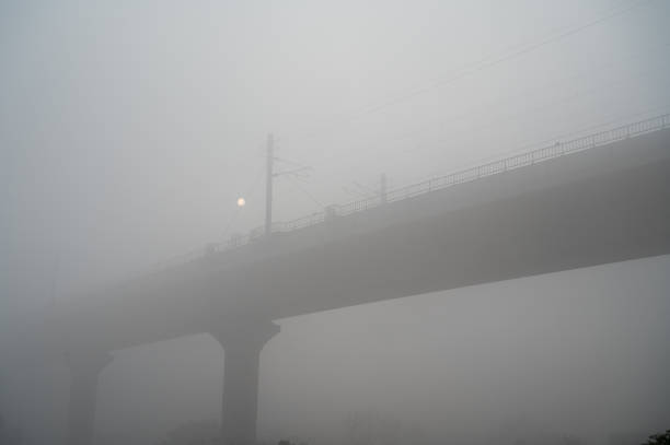 View of Delhi Metro bridge seen through thick smog.