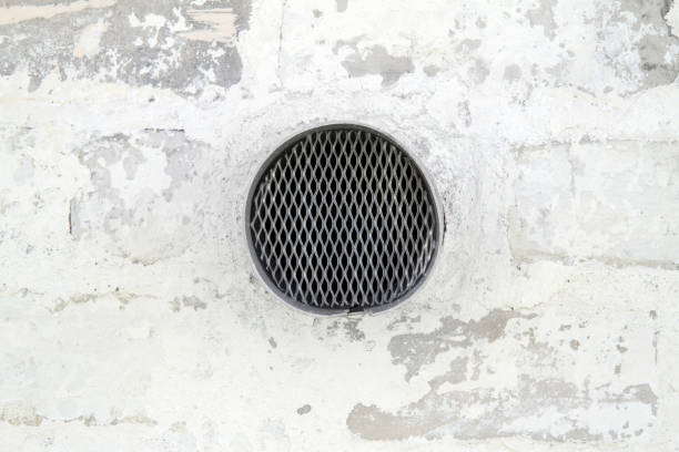 A black and white grainy images of i think of a  inside of a boiler.