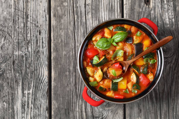 istock hearty italian vegetable stew in red pot, top view 2161423236
