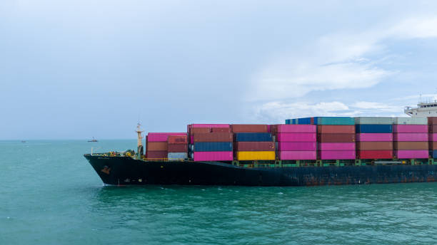 istock Side view Cargo container ship carrying container and running in the ocean near international container port customs shipyard sea port concept smart logistic service. transportation logistics trading. 2161425949