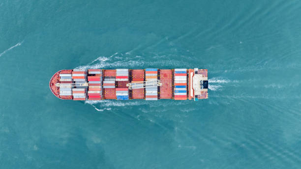 istock Cargo container ship carrying container and running in the ocean near international container port customs shipyard sea port concept smart logistic service. transportation logistics trading. 2161426028