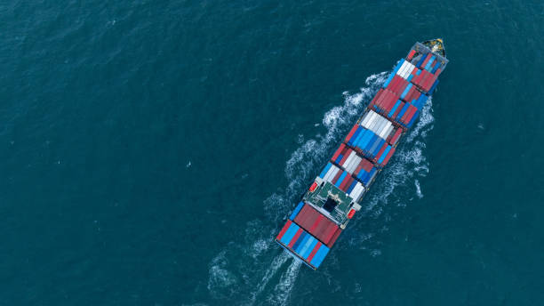 istock Cargo container ship carrying container and running in the ocean near international container port customs shipyard sea port concept smart logistic service. transportation logistics trading. 2161426084