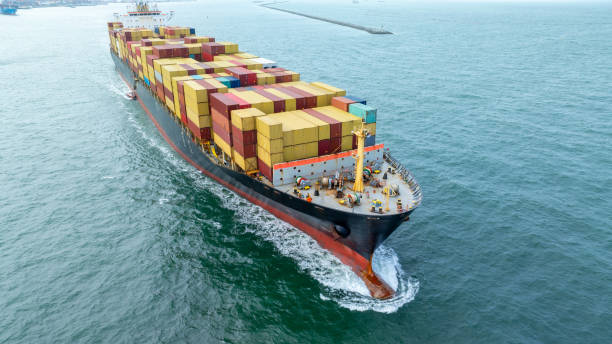 istock Cargo container ship carrying container and running in the ocean near international container port customs shipyard sea port concept smart logistic service. transportation logistics trading. 2161426108