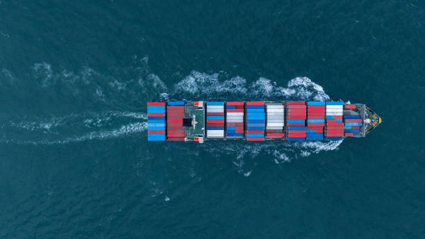 istock Cargo container ship carrying container and running in the ocean near international container port customs shipyard sea port concept smart logistic service. transportation logistics trading. 2161426136