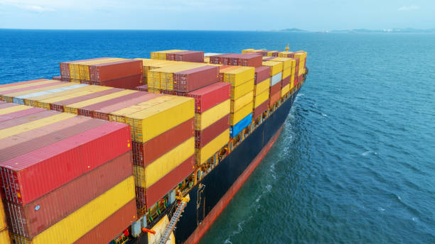 istock Side view Cargo container ship carrying container and running in the ocean near international container port customs shipyard sea port concept smart logistic service. transportation logistics trading. 2161426183