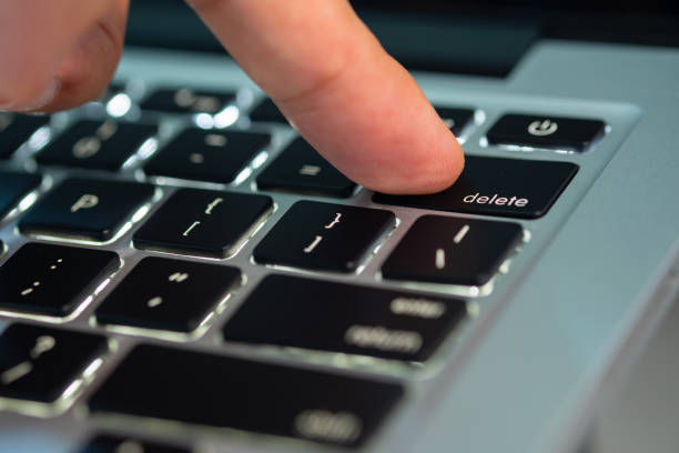 istock Finger of the computer user, he presses the delete button on the computer keyboard. 2161426945