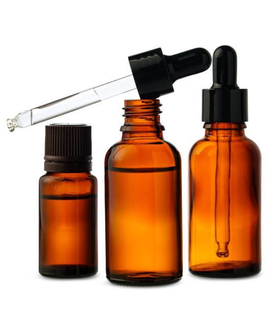 istock Three Amber Glass Dropper Bottles With Dropper Against White Background 2161428291