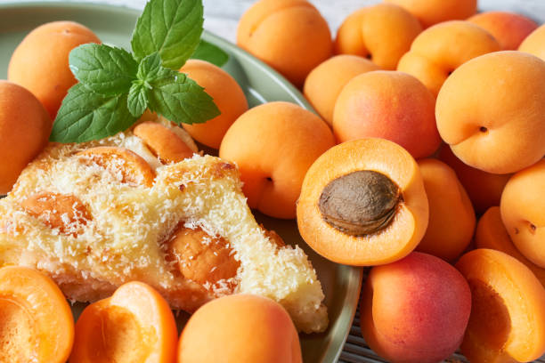 istock Delicious apricot cake with mint on table, closeup 2161432011