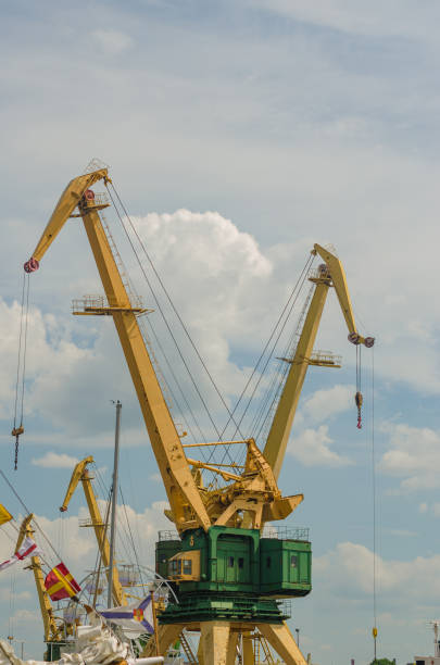 Working port cranes. Unloading and loading of goods at the port. High quality photo