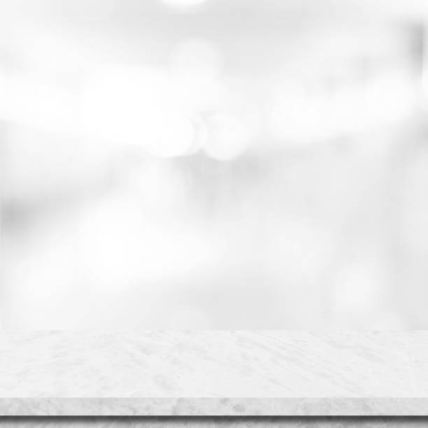 istock Empty white table top, counter, desk background over blur perspective bokeh light background, White marble stone table, shelf and blurred kitchen restaurant for food, product display mockup, template 2161434595