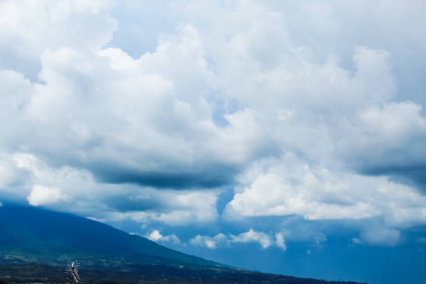 view of the sky with thick clouds overcast in the mountains