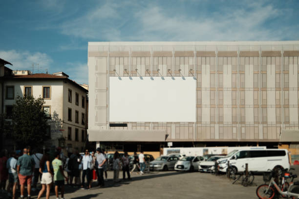 Large blank billboard with copy space for your advertising message is placed on the building at city square