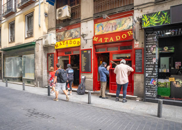 Madrid, Spain. 29 June 2024. Men sing outside the Matador bar in Madrid