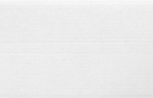 istock White cardboard sheet texture background, detail of recycle paper box pattern. 2161440727