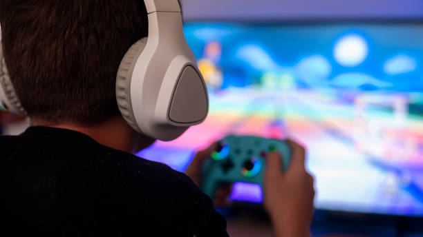 istock Boy addicted to playing video games 2161441160