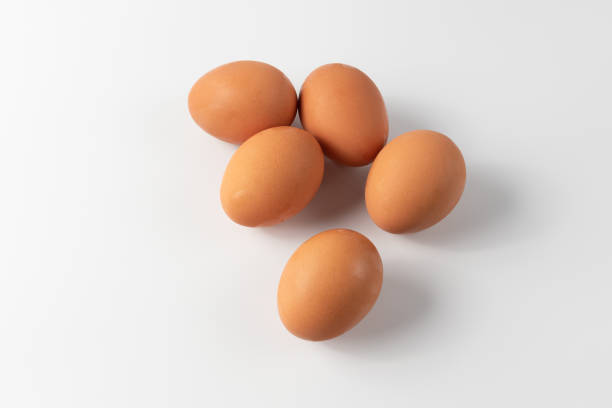 istock Fresh Chicken Eggs, close-up of eggs on white. 2161441299