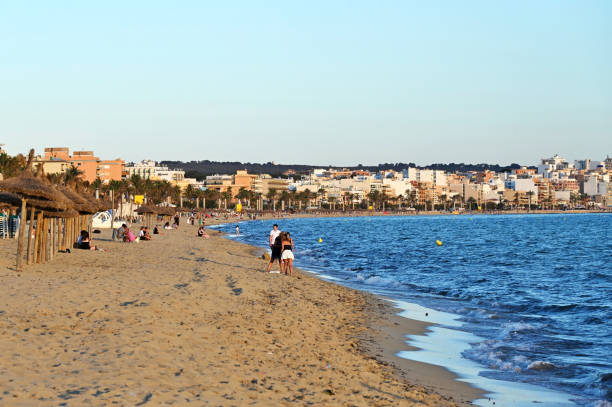 Palma de Mallorca, Spain - June 26th 2024: People enjoying sunset in a Mallorca beach
