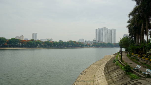 istock Lake view in a park with many trees 2161441876