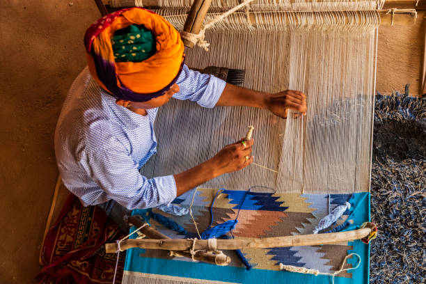 Indian man weaving textiles (durry) in Rajasthan