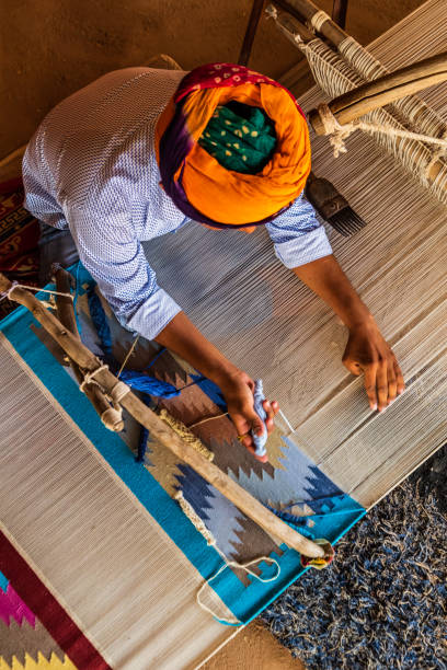 istock Indian man weaving textiles (durry) in Rajasthan 2161442519