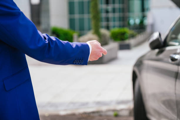 istock Unrecognizable businessman unlocking car with key fob 2161442829