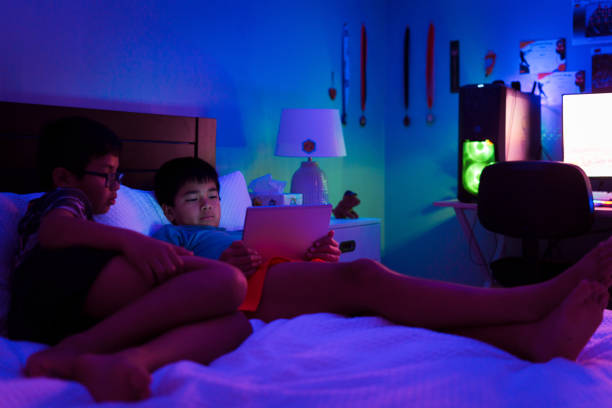 istock Brothers playing with tablet pc together. 2161444782
