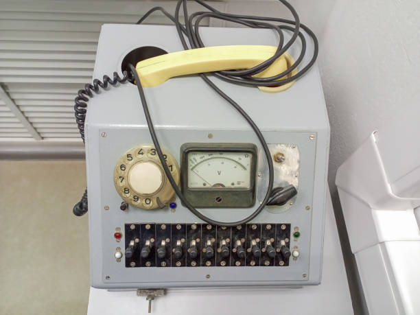 istock An old telephone set with a manual drum dialer with a voltmeter that can determine the technical parameters of the telephone communication network. 2161448918