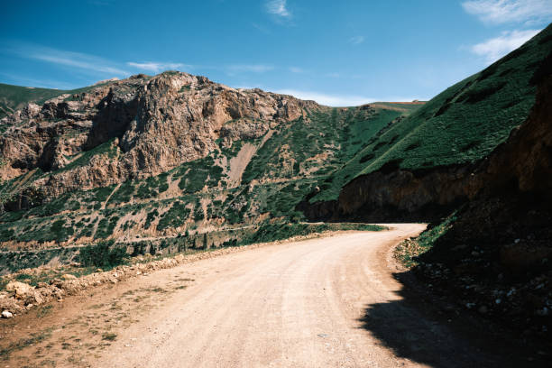 istock Green mountain pass with curvy road to the top 2161453324